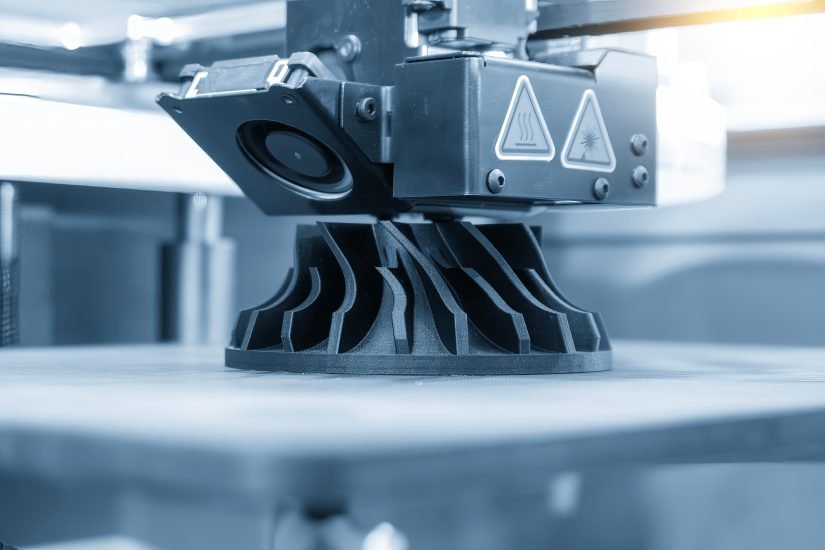 close up scene the additive manufacturing by 3d printer machine in the light blue scene.